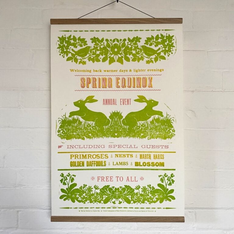 Sophie Elm Design Spring Equinox Letterpress poster hanging on a white brick wall.