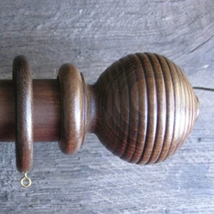 a 2" diameter walnut curtain pole