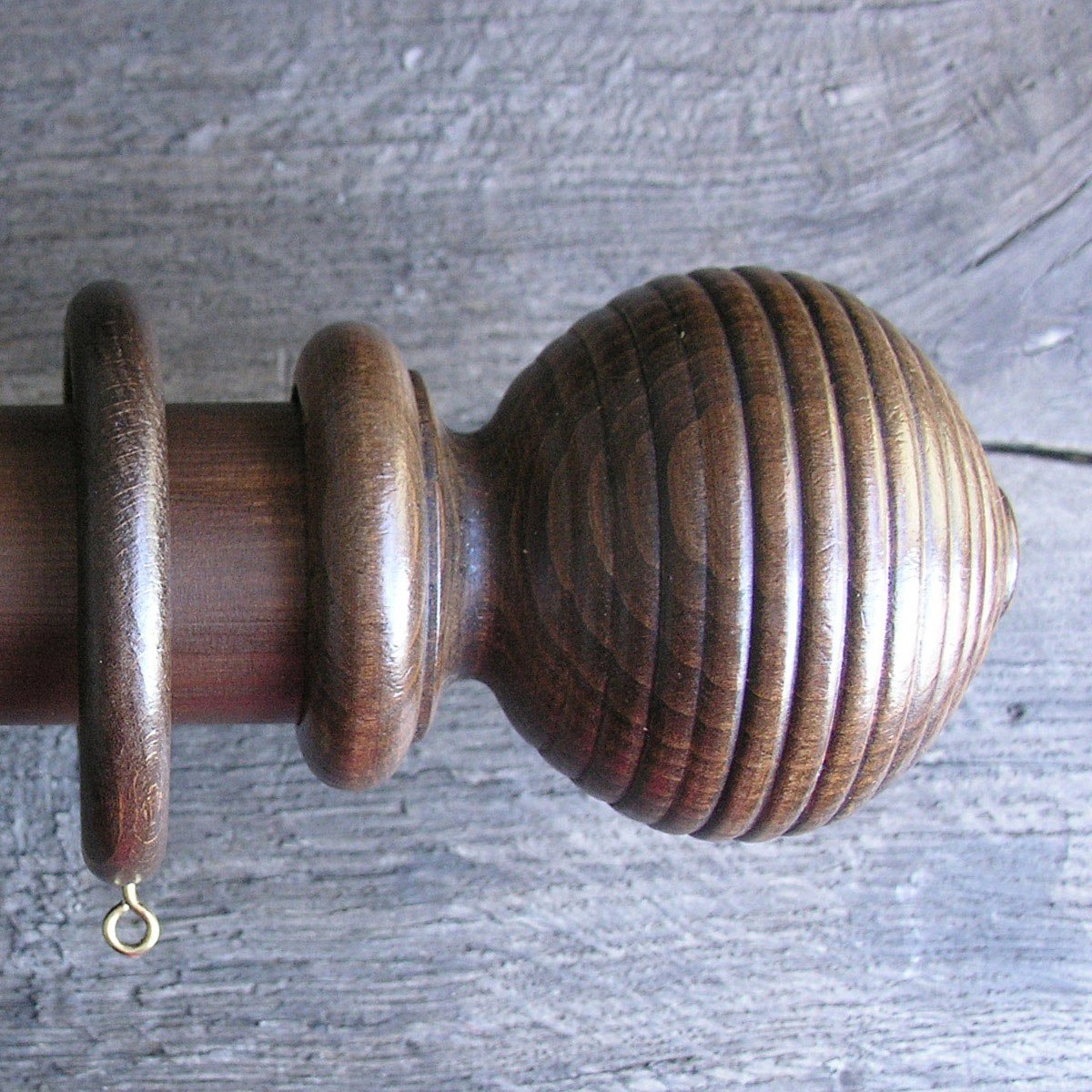 a 2" diameter walnut curtain pole