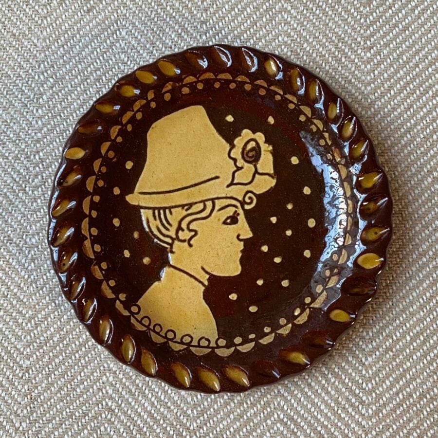 SORKD6 Katie Morgan Hat Woman Katie B Morgan slipware dish for Tinsmiths Ledbury