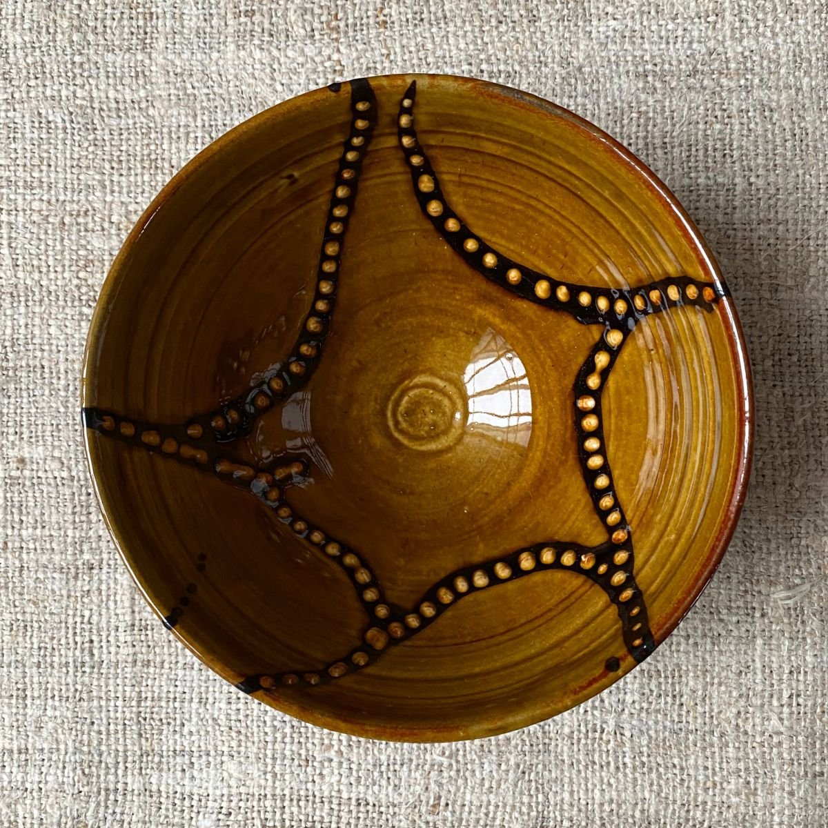 Erica Taylor Low Ceramic deep bowl in an amber glaze