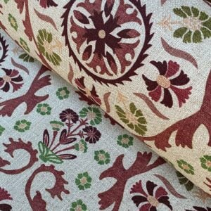 Tinsmiths Extra Wide Suzani print cloth on a roll in Henna Brown & Olive Green