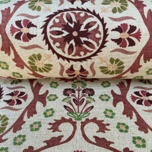 Tinsmiths Extra Wide Suzani print cloth on a roll in Henna Brown & Olive Green