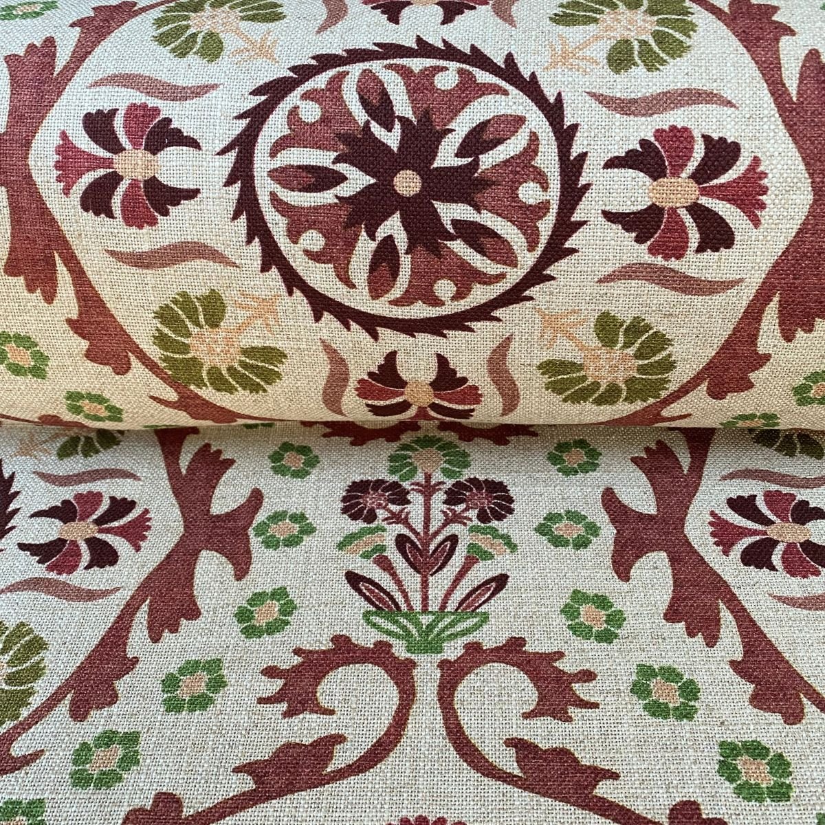 Tinsmiths Extra Wide Suzani print cloth on a roll in Henna Brown & Olive Green