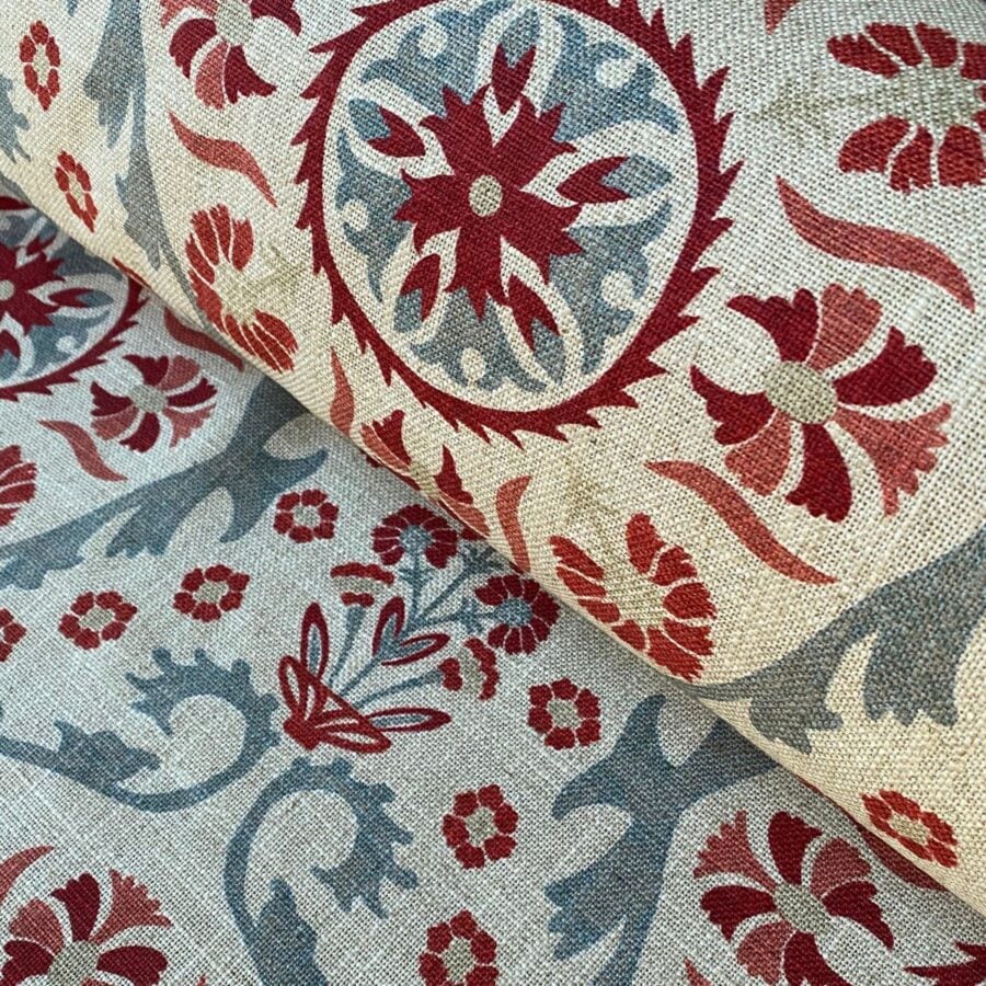 Tinsmiths Extra Wide Suzani print cloth on a roll in Strawberry & Duckegg