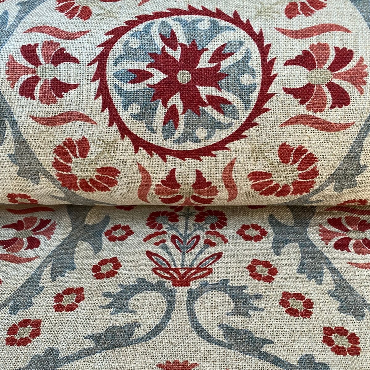 Tinsmiths Extra Wide Suzani print cloth on a roll in Strawberry & Duckegg