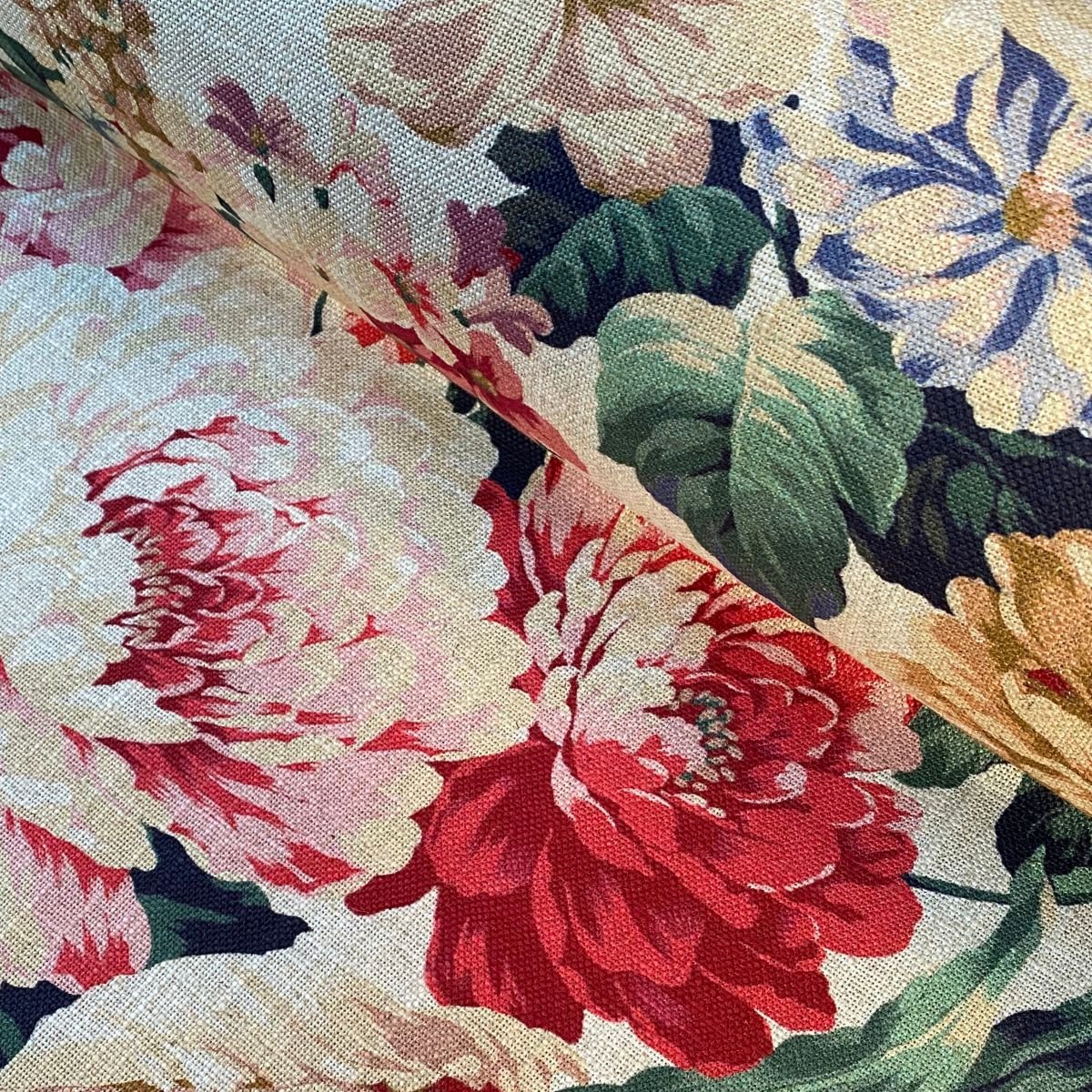 Tinsmiths Extra Wide Grandiflora fabric on a roll in red, blue & gold.