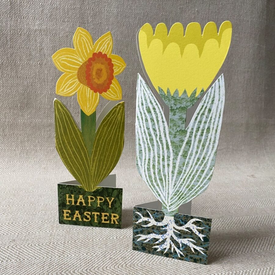 Upright yellow tulip shaped greetings card on a neutral background