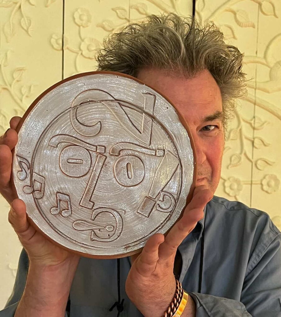 John Ingledew holdings a ceramic Type Faces plate