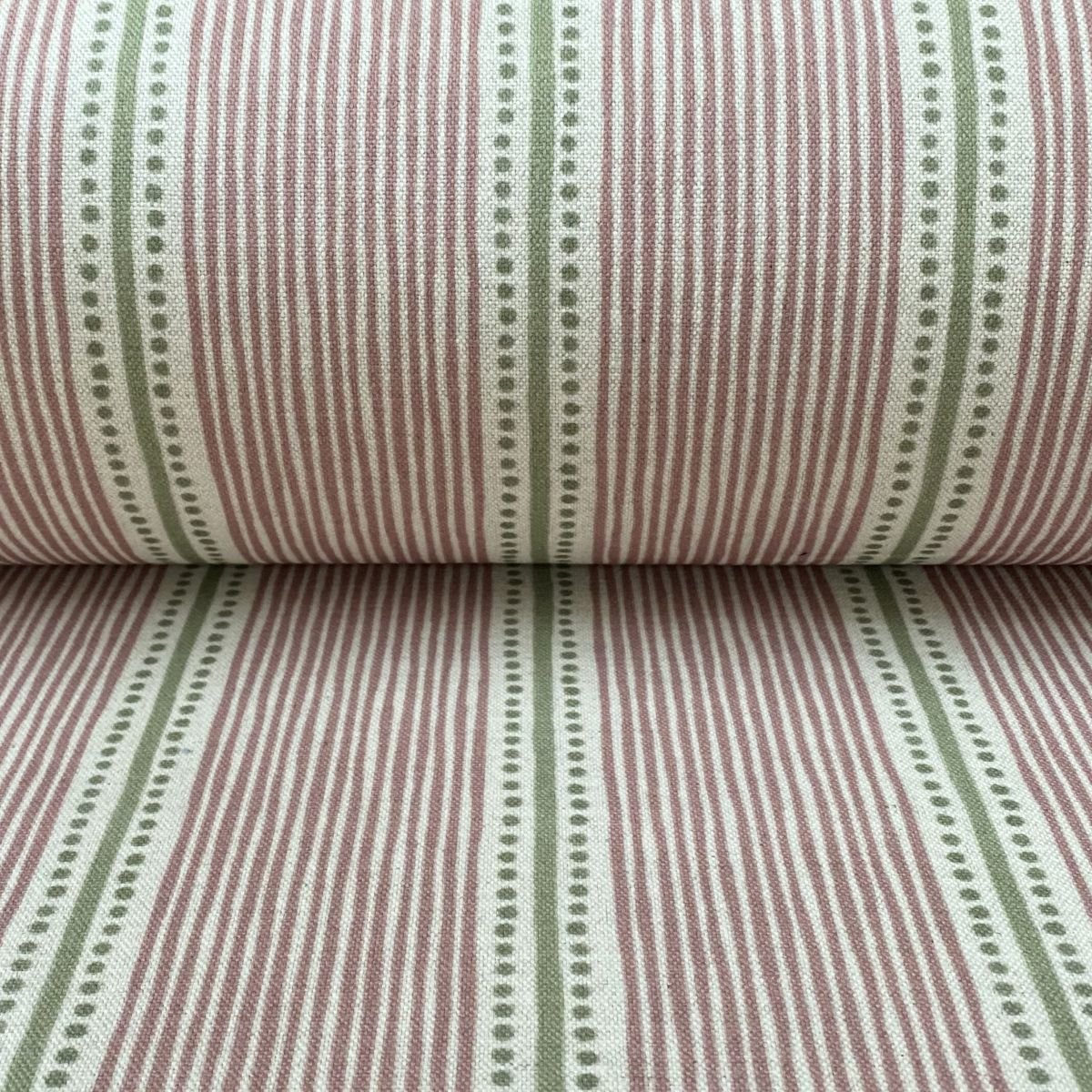 Pink & Green striped fabric on a roll at an angle