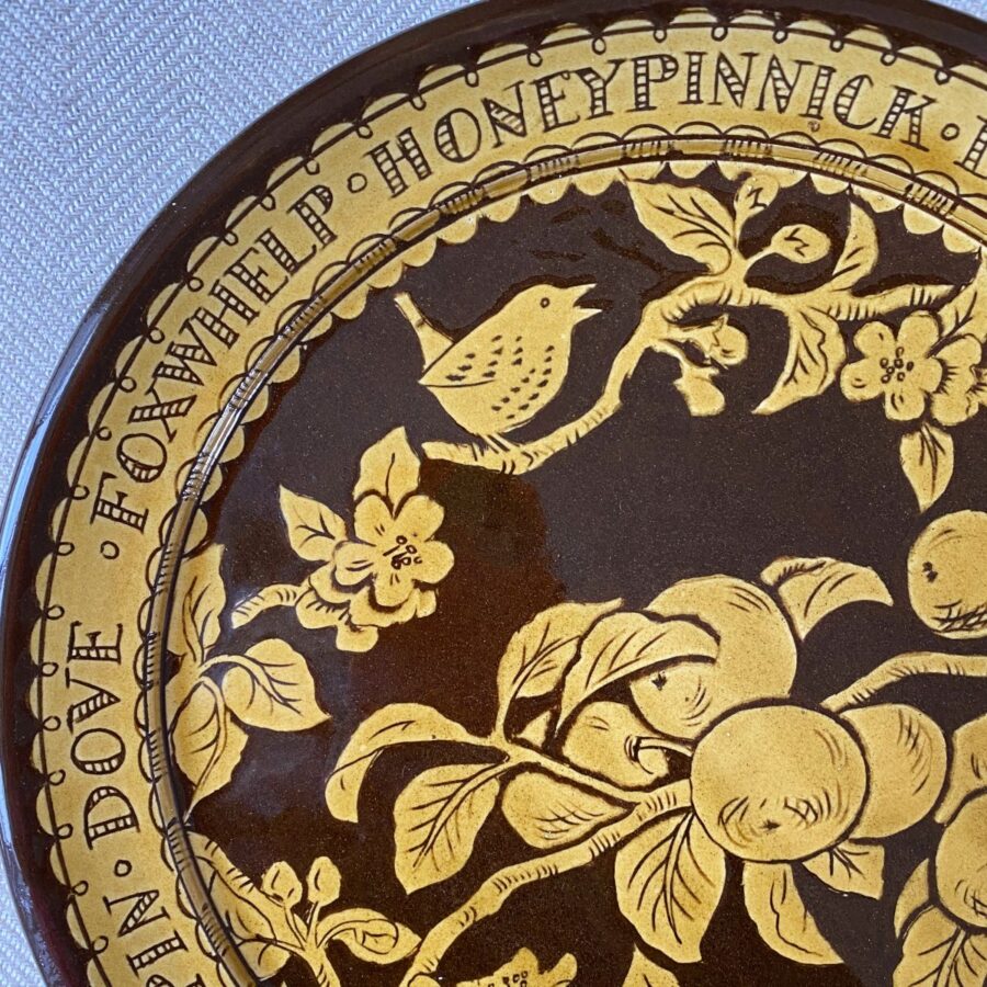Detail of a Katie B Morgan slipware Plate on a tablecloth