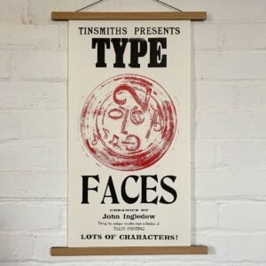 Type Faces Letterpress Poster on a white wall