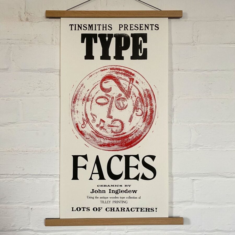 Type Faces Letterpress Poster on a white wall