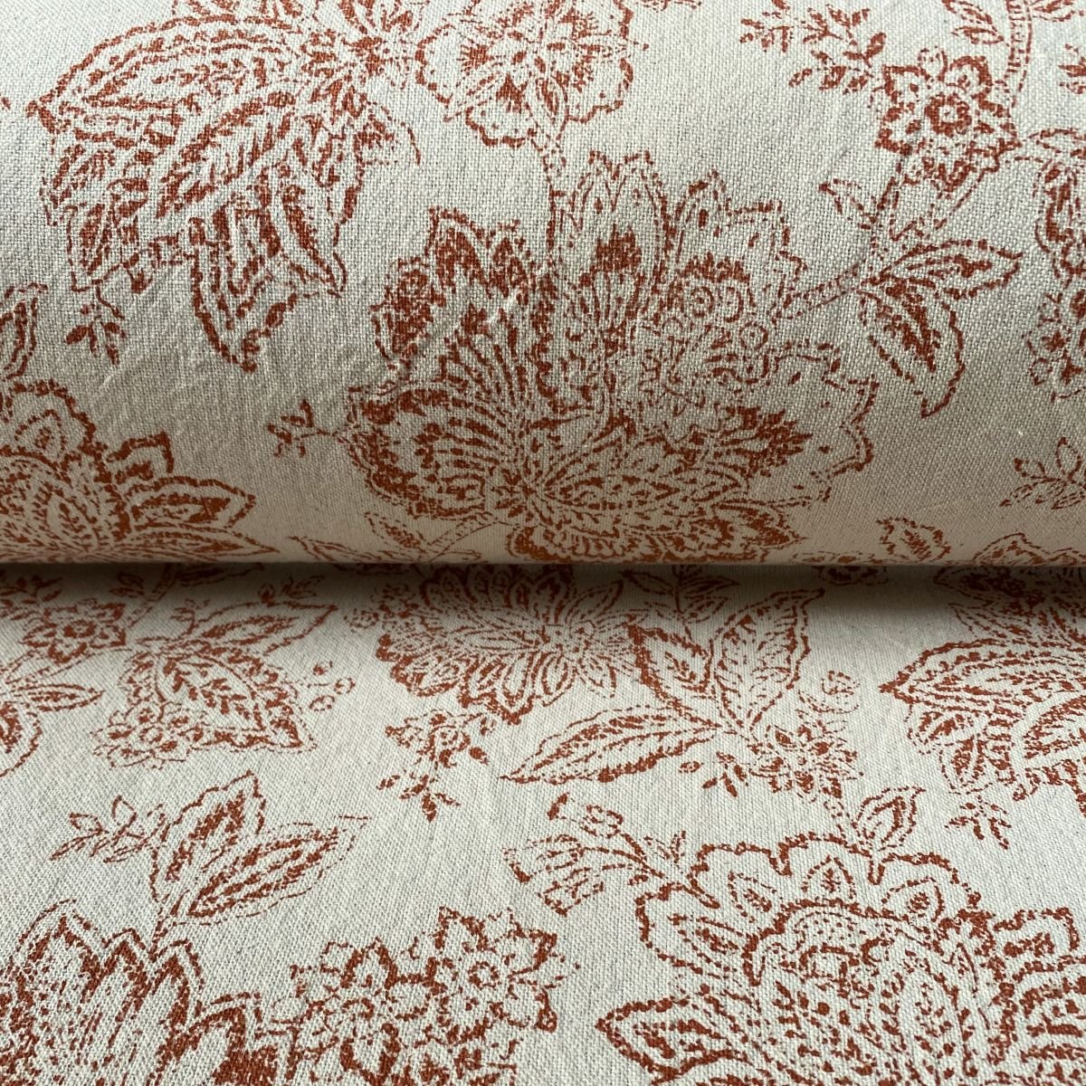 Tree of Life patterned fabric on a slanted roll
