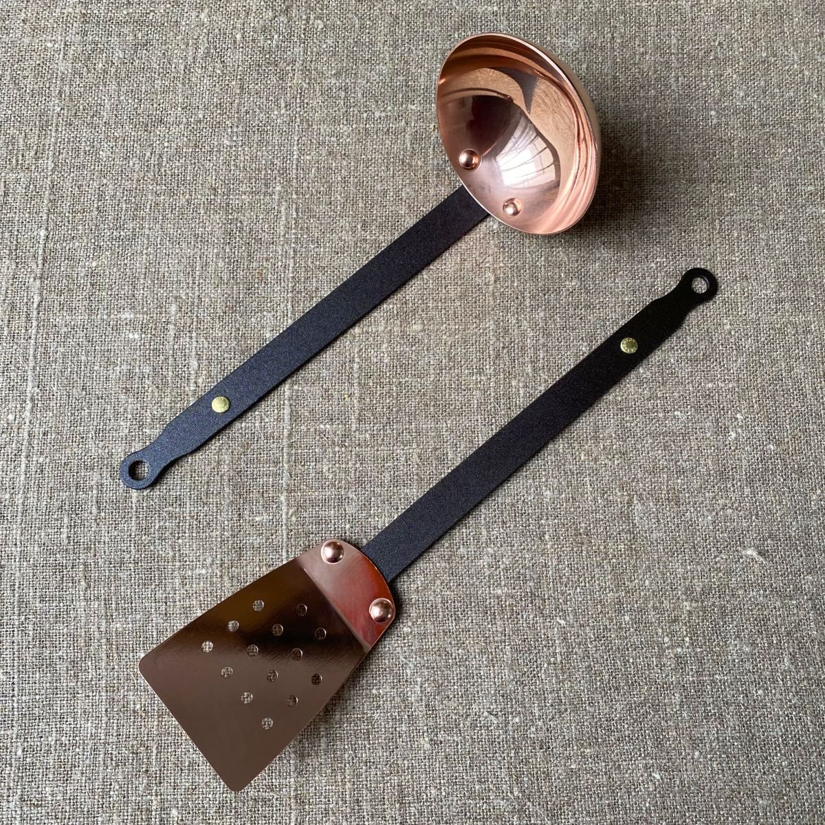 Pair of copper Netherton Foundry copper utensils; ladle and a spatula