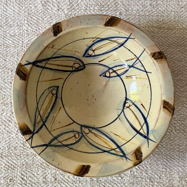 Jennifer Hall slipware breakfast bowls from above on a cream textile background