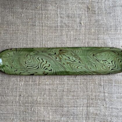Patia Davis extra long oval platter with green glaze on linen backcloth