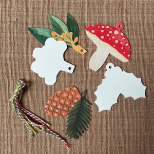 Hadley set of 5 Festive Gift Tags on pink cloth background