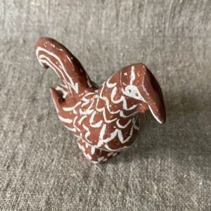 Emma Carlow Upright Cockerel clay whistle on cloth background