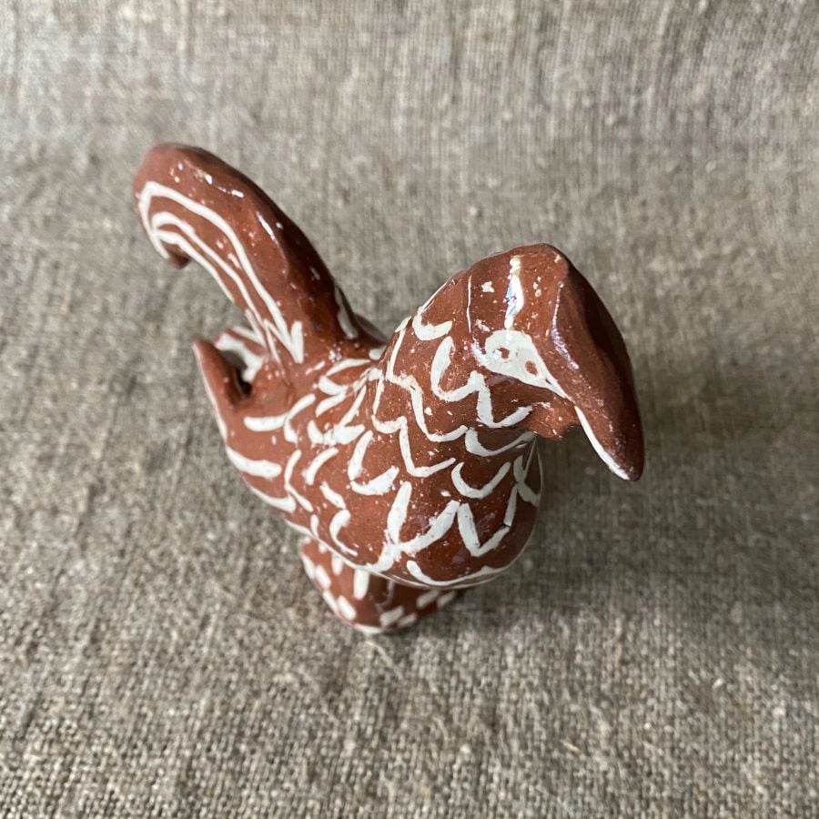 Emma Carlow Upright Cockerel clay whistle on cloth background