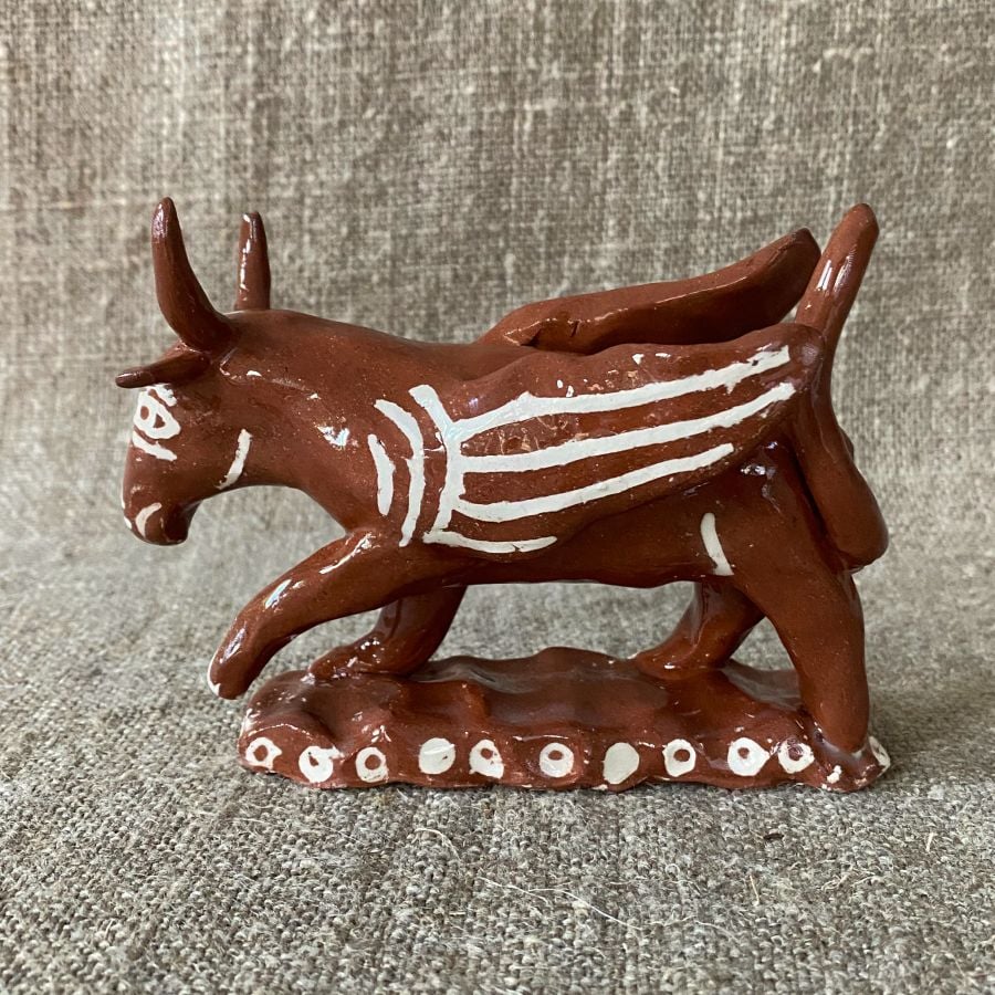 Emma Carlow winged bull pottery whistle against fabric background