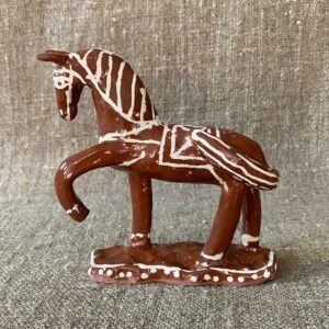 Emma Carlow horse pottery whistle against fabric background