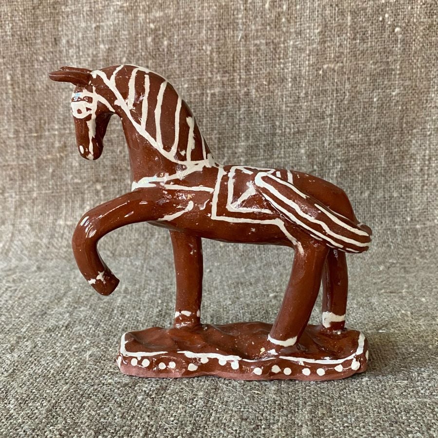 Emma Carlow horse pottery whistle against fabric background