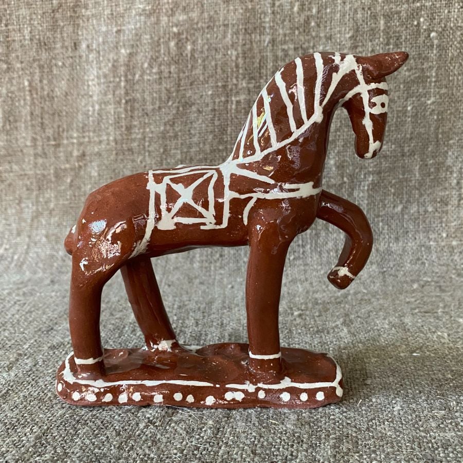 Emma Carlow horse pottery whistle against fabric background