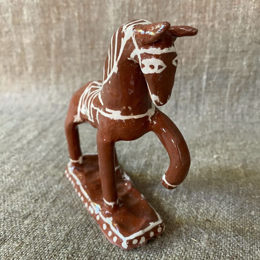 Emma Carlow horse pottery whistle against fabric background