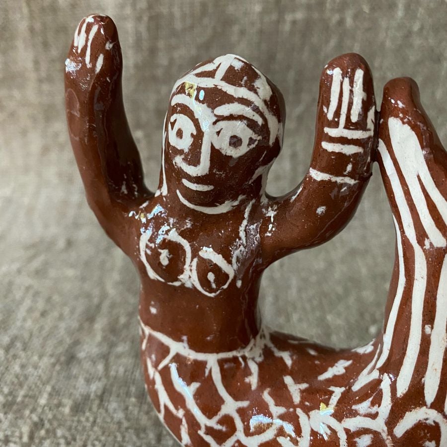 Emma Carlow mermaid pottery whistle against fabric background