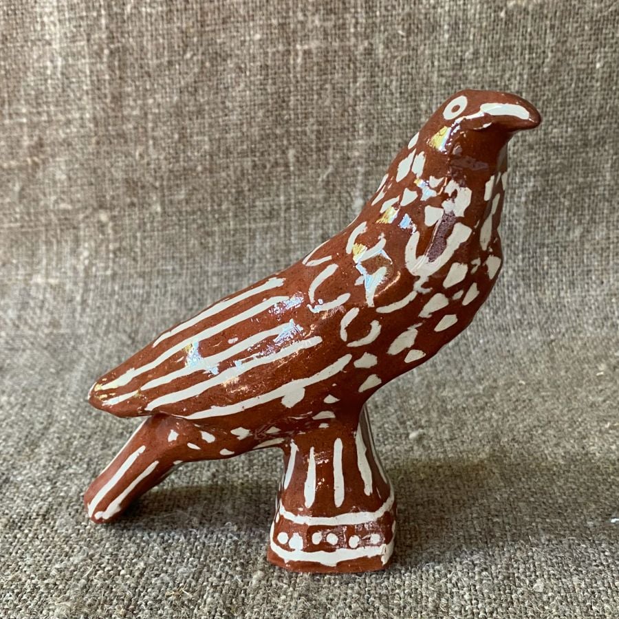 Emma Carlow bird pottery whistle against fabric background