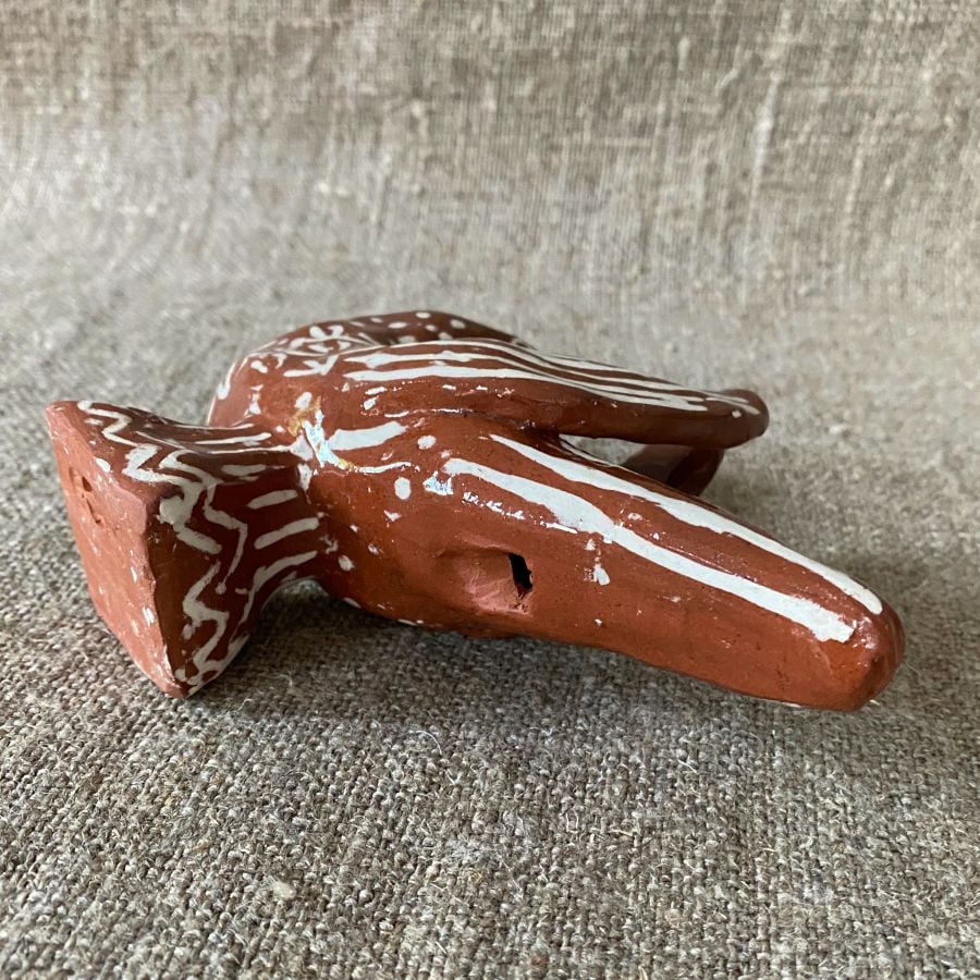 Emma Carlow bird pottery whistle against fabric background
