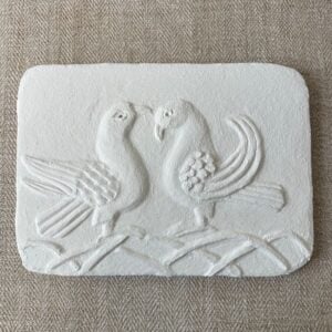 Pargetted lime plaster relief featuring a air of stylised doves