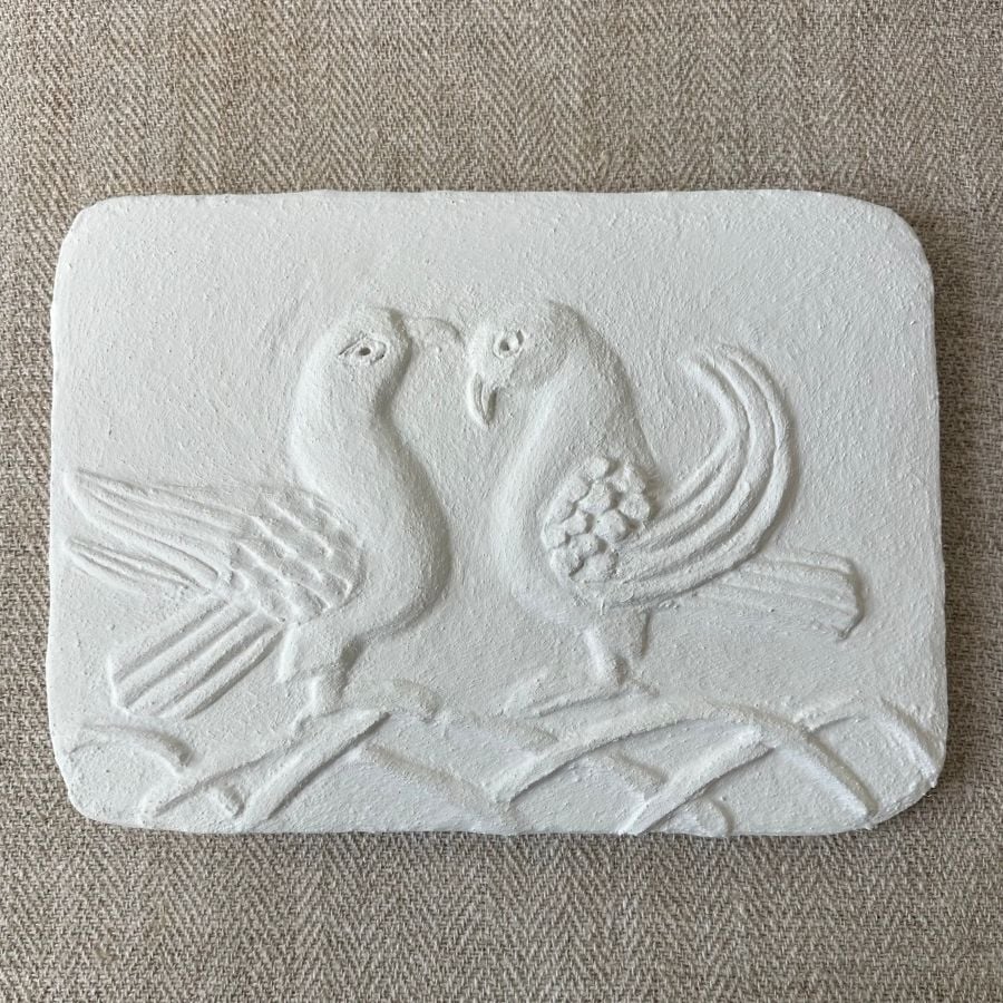 Pargetted lime plaster relief featuring a air of stylised doves