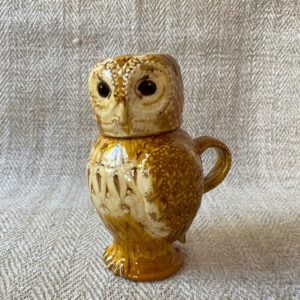 Pottery jug in shape of an ow, with a removable head