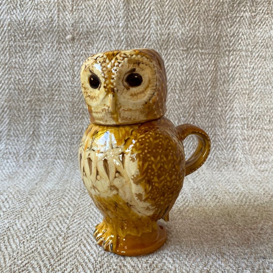 Pottery jug in shape of an ow, with a removable head