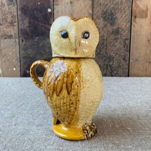 Pottery jug in shape of an ow, with a removable head