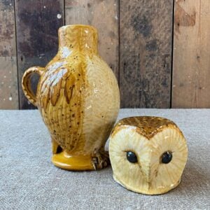 Pottery jug in shape of an ow, with a removable head