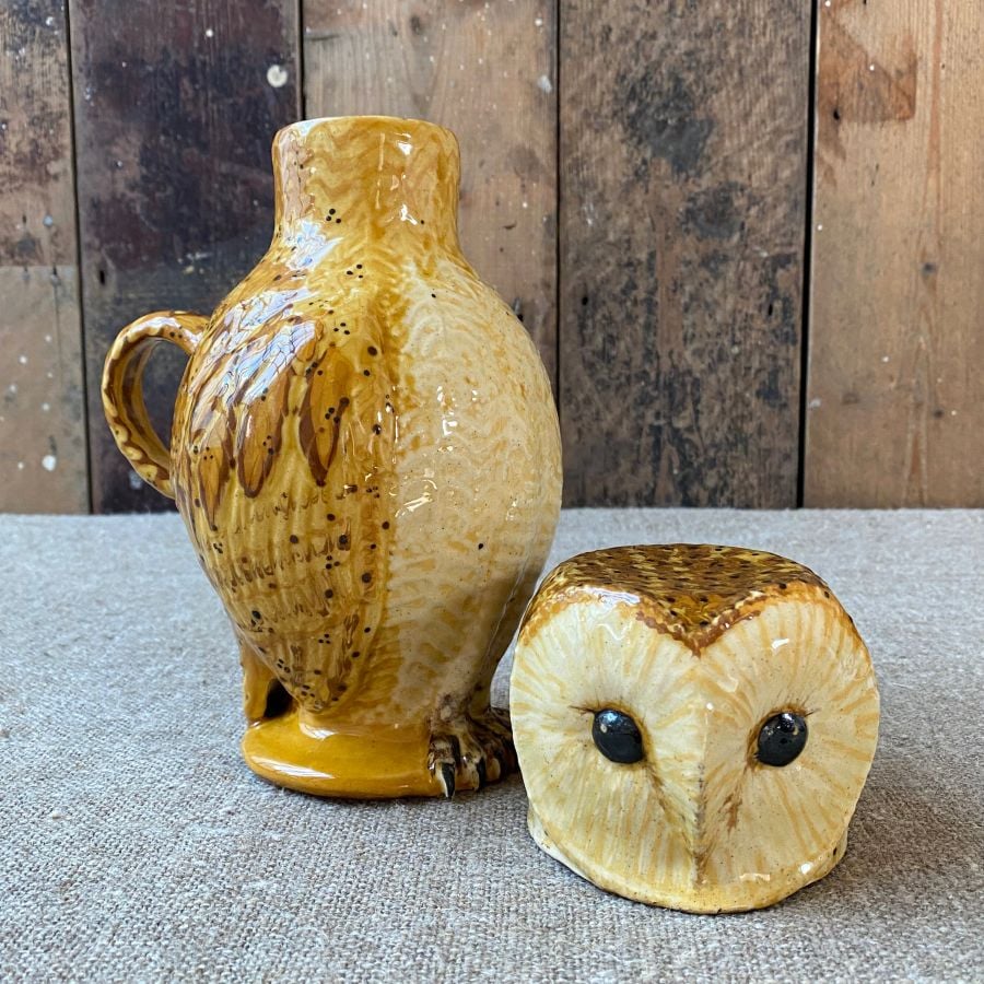 Pottery jug in shape of an ow, with a removable head