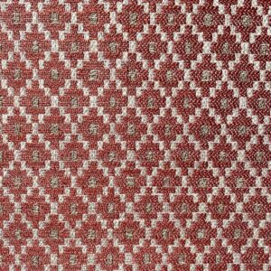 Brick red upholstery fabric with a small diamond shaped pattern in the weave