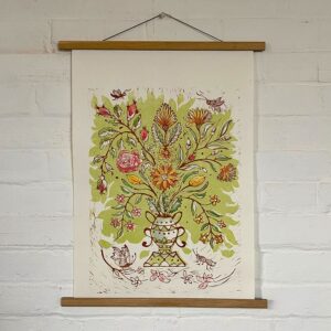 Jen Whiskerd hand coloured lino print on a white wall