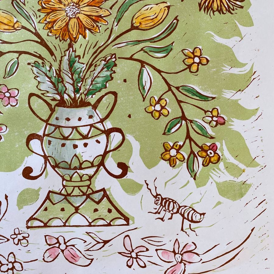 Jen Whiskerd hand coloured lino print on a white wall