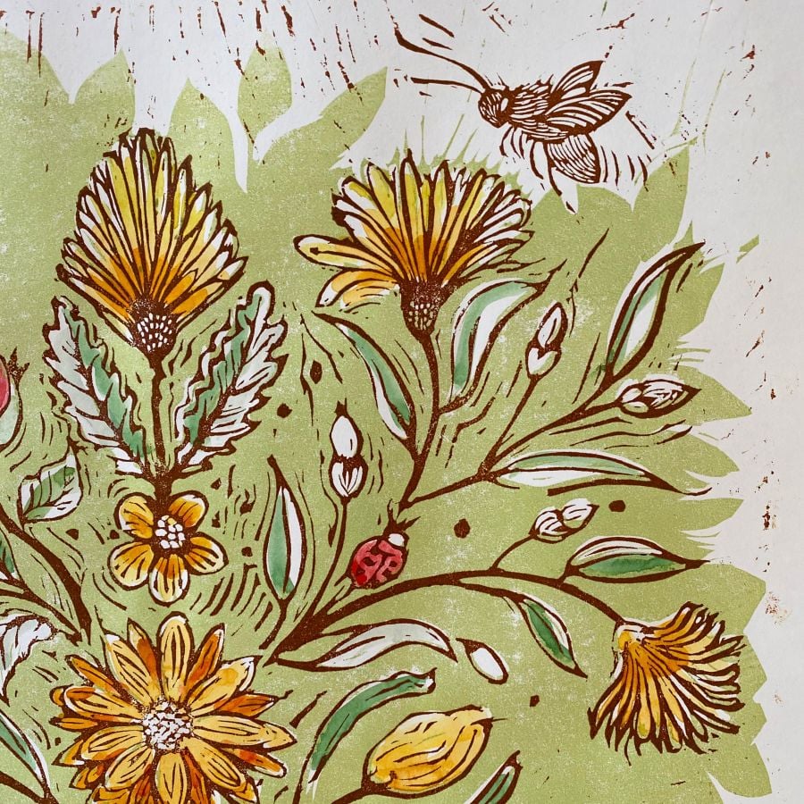 Jen Whiskerd hand coloured lino print on a white wall