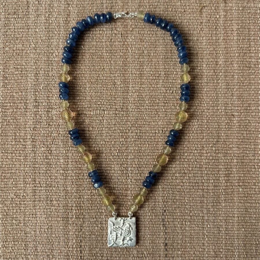Silver Hawk necklace with blue and amber beads