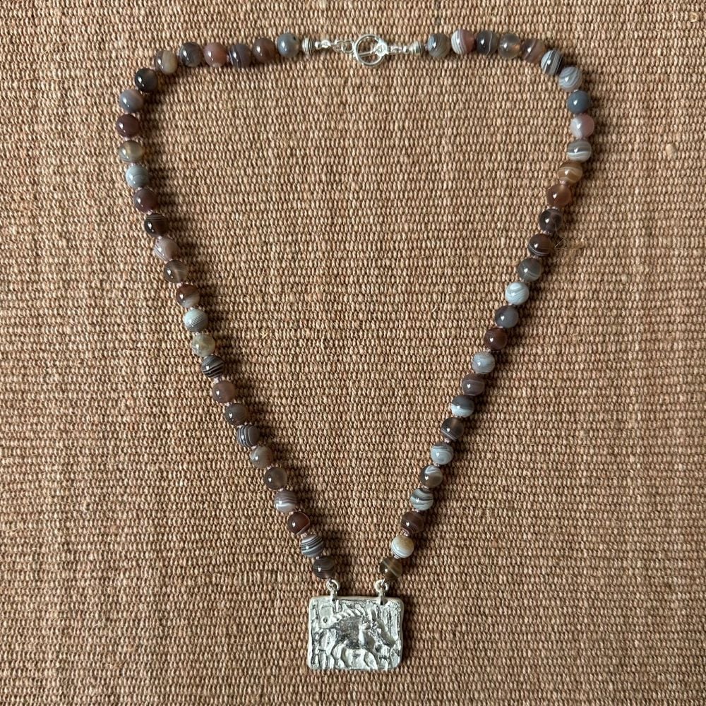 Silver boar pendant with agate necklace