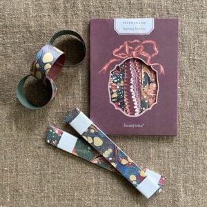 Pack of marbled paper chains on a cloth background