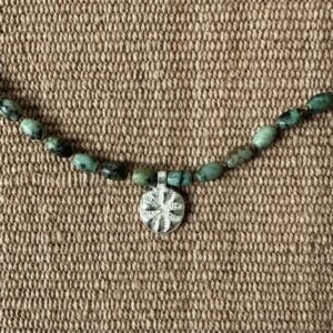 Primitive cross and turquoise necklace