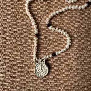 A seed pearl and red tigers eye necklace with