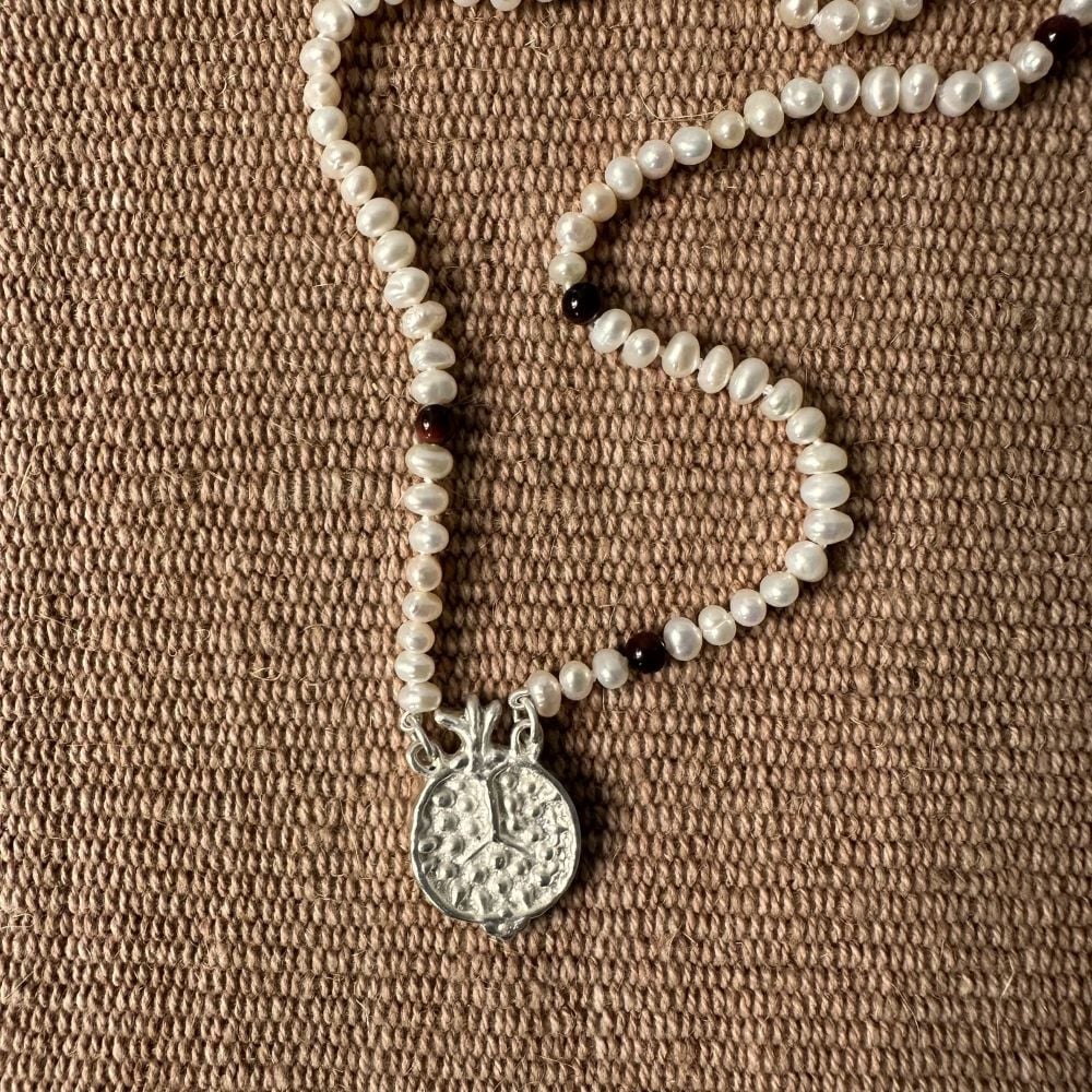 A seed pearl and red tigers eye necklace with