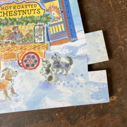 Emily Sutton's illustrated High Street advent calendar, upright against a wooden backdrop